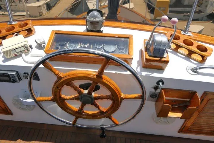 Slide: The Image of Helm of 1983 CHB 45 boat with wooden wheel and control panel. - 59