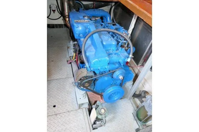 Slide: The Image of Blue marine engine in a 1983 CHB 45 boat, detailed view. - 66