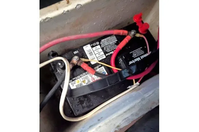 Slide: The Image of Battery with red and white cables in a CHB 45, 1983 model. - 75