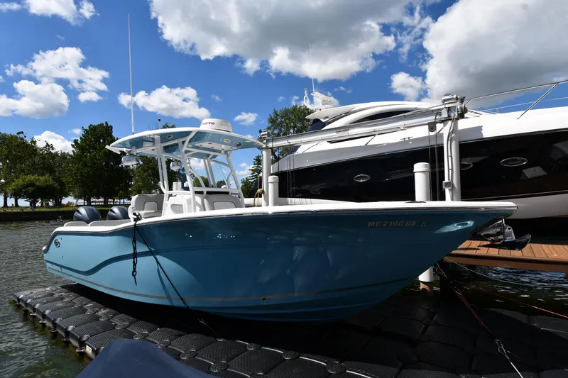 The Image of 2022 Sea Fox 268 Commander boat docked on a sunny day with blue skies. - 0