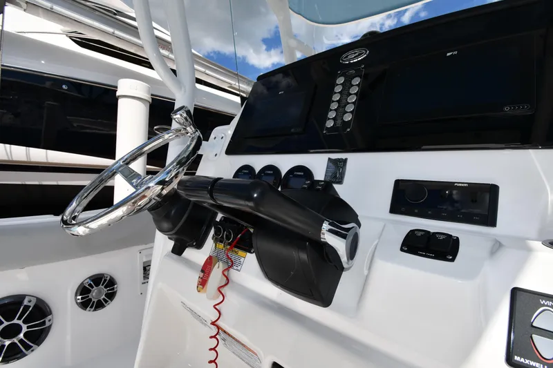 Slide: The Image of 2022 Sea Fox 268 Commander boat dashboard with steering wheel and control panel. - 18