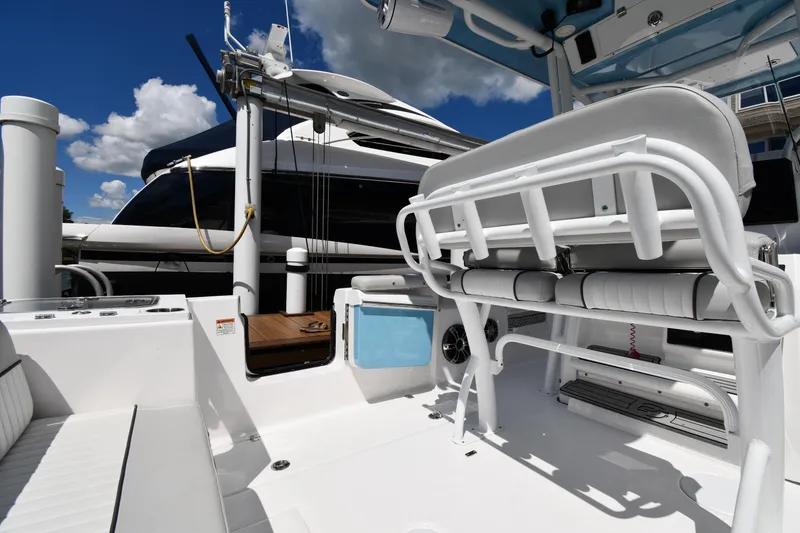 Slide: The Image of 2022 Sea Fox 268 Commander boat interior with seating and equipment under blue sky. - 22