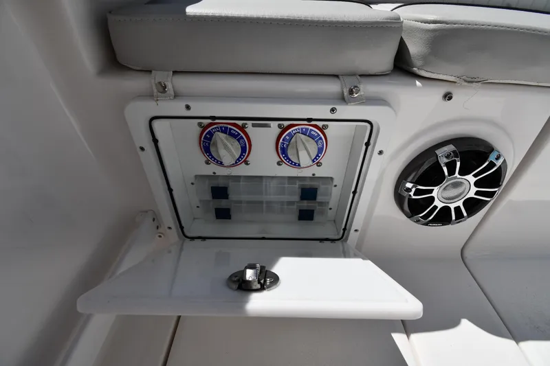 Slide: The Image of 2022 Sea Fox 268 Commander boat control panel with speaker and storage compartment. - 26