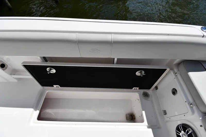 Slide: The Image of 2022 Sea Fox 268 Commander boat storage compartment with open lid, showcasing interior space. - 27