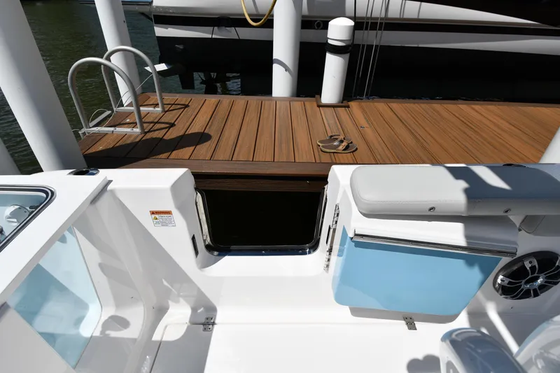 Slide: The Image of 2022 Sea Fox 268 Commander boat interior with dock view and seating area. - 29