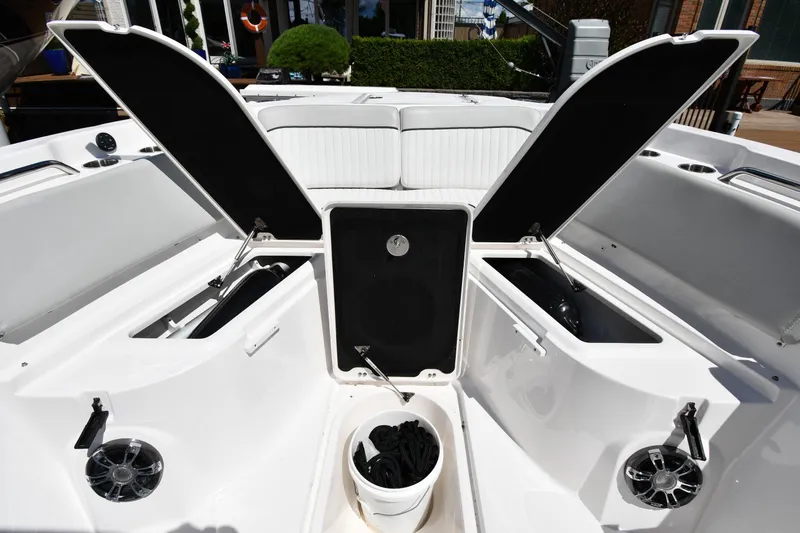 Slide: The Image of 2022 Sea Fox 268 Commander boat interior with open storage compartments and seating. - 39