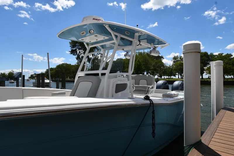 Slide: The Image of 2022 Sea Fox 268 Commander boat docked under a clear blue sky. - 4
