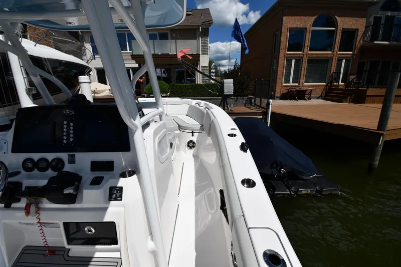 Slide: The Image of 2022 Sea Fox 268 Commander boat docked near waterfront homes. - 40