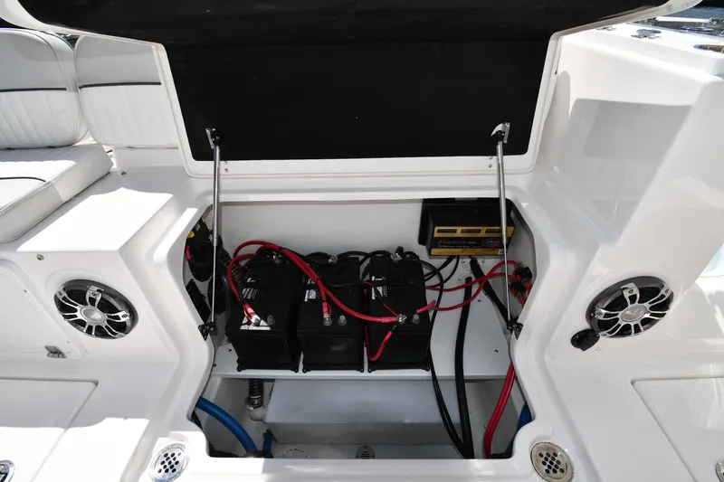 Slide: The Image of 2022 Sea Fox 268 Commander boat battery compartment with wiring and speakers. - 48