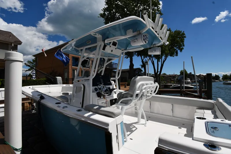 Slide: The Image of 2022 Sea Fox 268 Commander boat docked under a clear blue sky. - 5