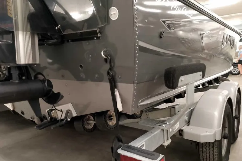 Slide: The Image of 2016 Lund 2075 Pro Guide boat on trailer, rear view in indoor setting. - 13