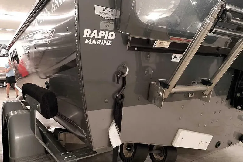 Slide: The Image of 2016 Lund 2075 Pro Guide boat on trailer, featuring Rapid Marine branding. - 14