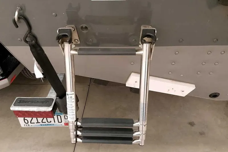 Slide: The Image of 2016 Lund 2075 Pro Guide boat ladder and trailer hitch detail. - 15