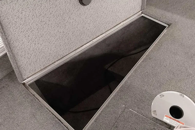 Slide: The Image of Open storage compartment in 2016 Lund 2075 Pro Guide boat interior. - 25