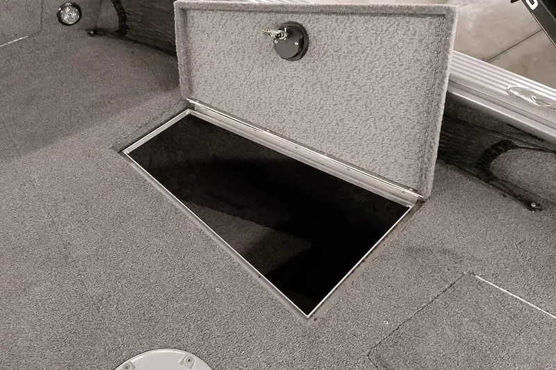 Slide: The Image of 2016 Lund 2075 Pro Guide boat with open storage compartment. - 26