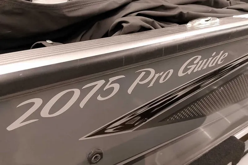 Slide: The Image of 2016 Lund 2075 Pro Guide boat, close-up of model name on side. - 3