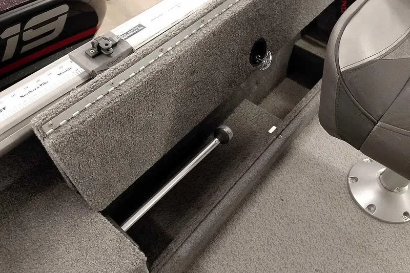 Slide: The Image of 2016 Lund 2075 Pro Guide boat interior with carpeted storage and seating. - 30