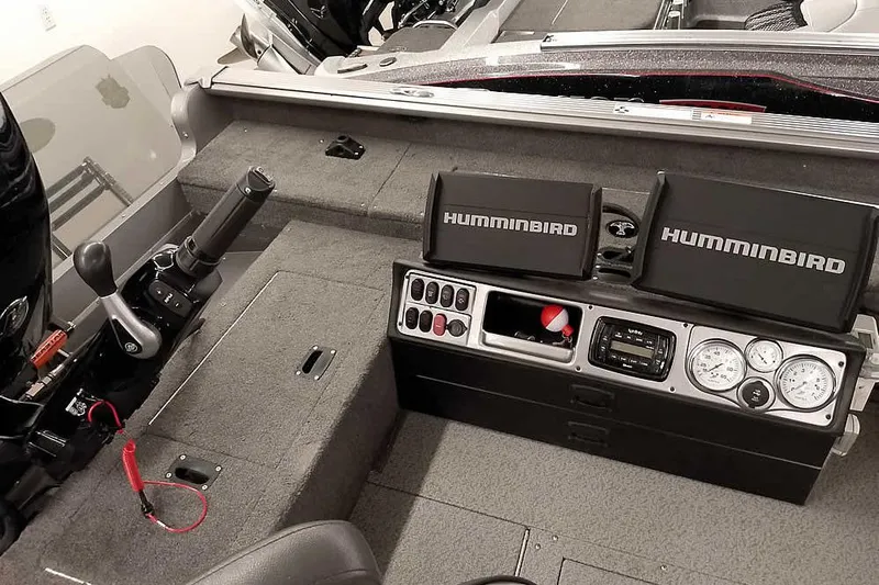 Slide: The Image of 2016 Lund 2075 Pro Guide boat dashboard with Humminbird electronics and control panel. - 32