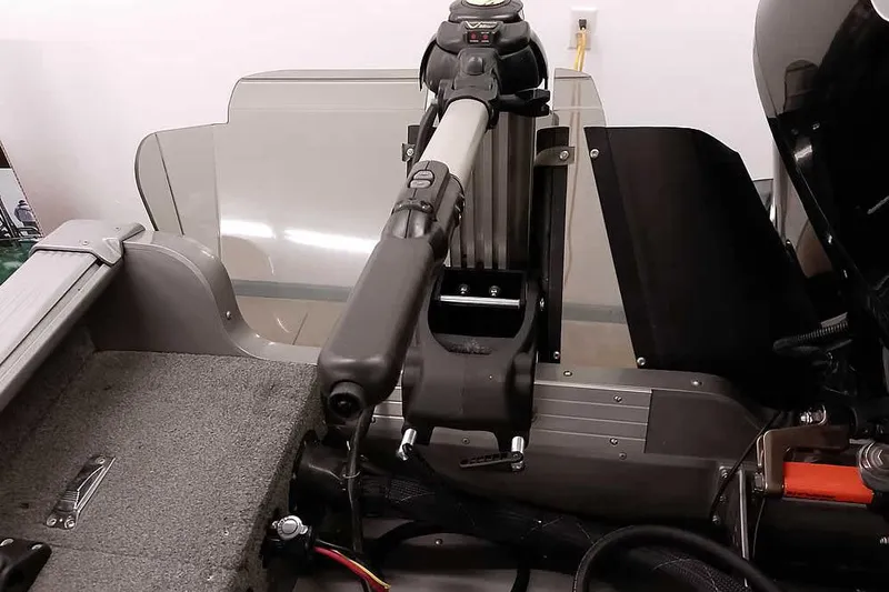 Slide: The Image of 2016 Lund 2075 Pro Guide boat interior with steering mechanism and control panel. - 40