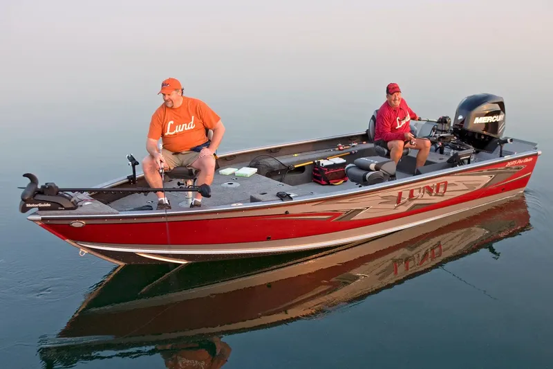 Slide: The Image of Manufacturer Provided Image: 2016 Lund 2075 Pro Guide fishing boat on calm water with two anglers. - 43
