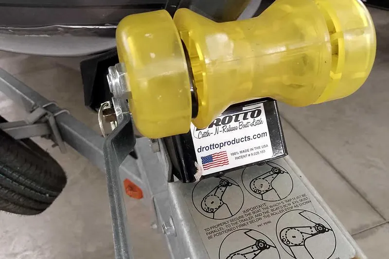 Slide: The Image of Yellow boat trailer roller on 2016 Lund 2075 Pro Guide with Drotto latch system. - 7