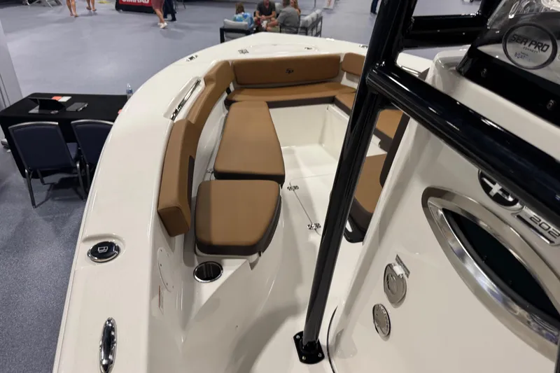 Slide: The Image of 2026 Sea Pro 202 Center Console boat interior with brown seating and modern design. - 14