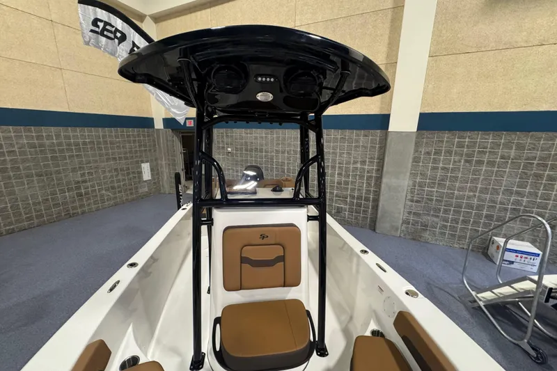 Slide: The Image of 2026 Sea Pro 202 Center Console boat interior with seating and T-top. - 16