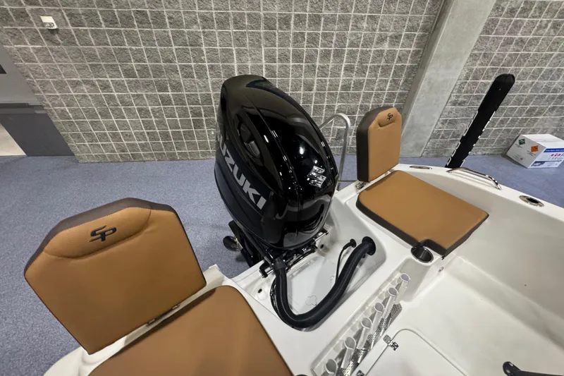 Slide: The Image of 2026 Sea Pro 202 Center Console boat with Suzuki outboard motor, tan seating. - 20