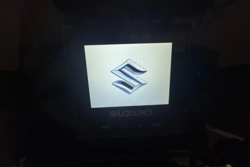 Slide: The Image of Suzuki logo on display screen of 2026 Sea Pro 202 Center Console boat. - 21