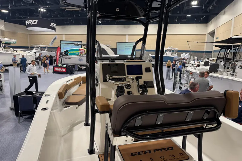 Slide: The Image of 2026 Sea Pro 202 Center Console boat displayed at a marine exhibition. - 9