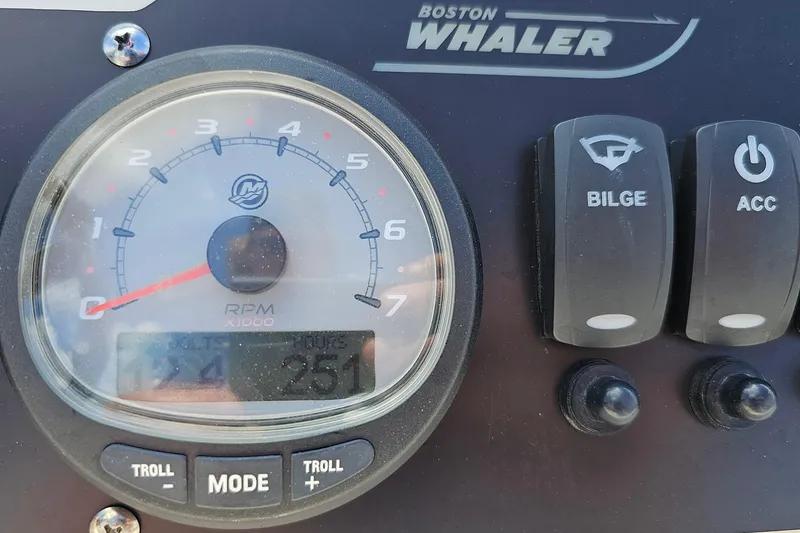 Slide: The Image of Close-up of 2018 Boston Whaler 210 Dauntless dashboard with RPM gauge and switches. - 20