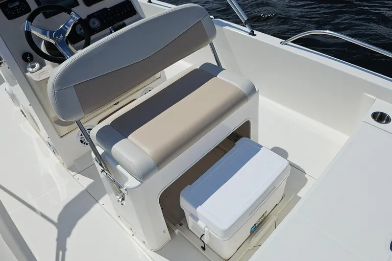 Slide: The Image of 2018 Boston Whaler 210 Dauntless boat interior with seating and storage area. - 28