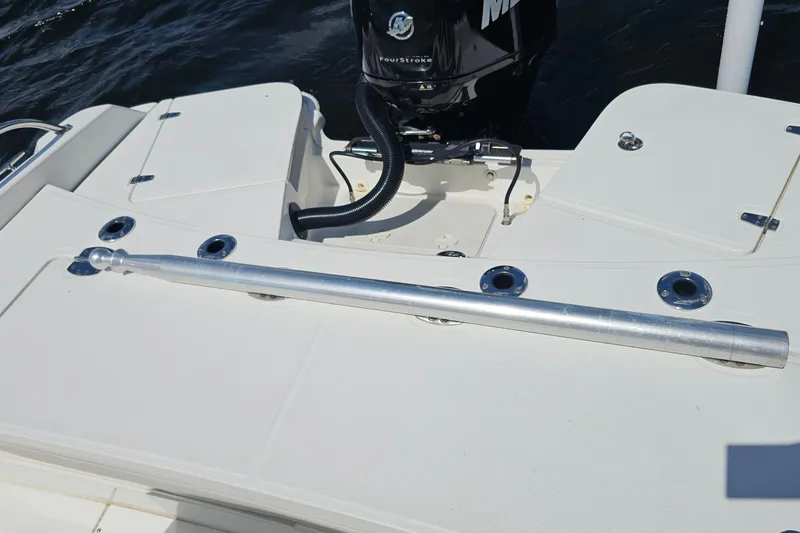 Slide: The Image of Boston Whaler 210 Dauntless 2018 boat deck with motor and rod holders. - 38
