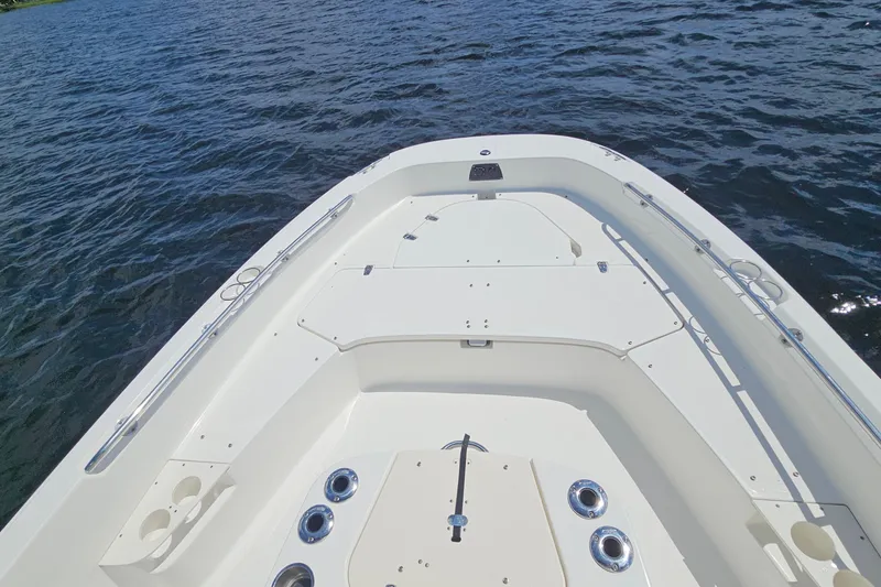 Slide: The Image of 2018 Boston Whaler 210 Dauntless boat deck on calm water. - 40