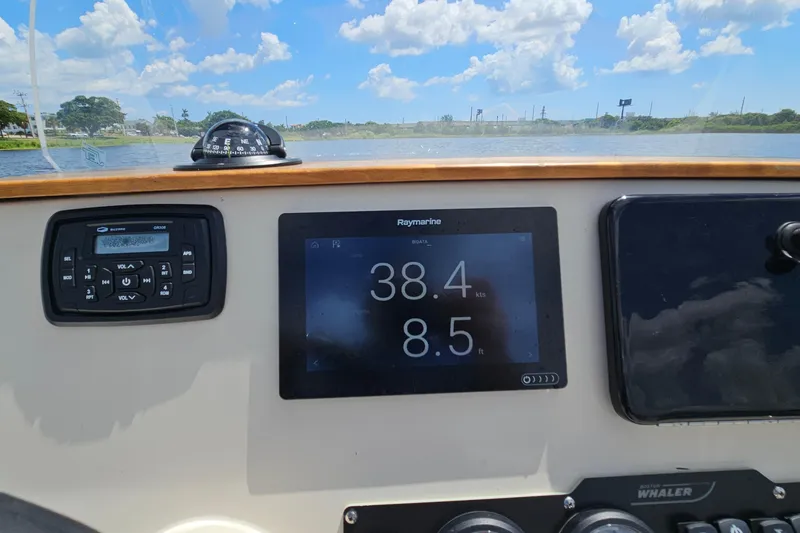Slide: The Image of Dashboard of a 2018 Boston Whaler 210 Dauntless with navigation instruments. - 46