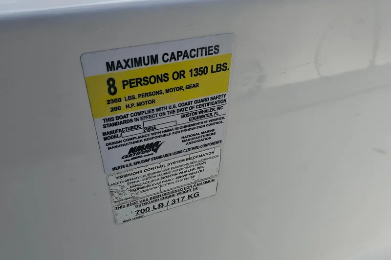 Slide: The Image of Capacity label on 2018 Boston Whaler 210 Dauntless, max 8 persons or 1350 lbs. - 51