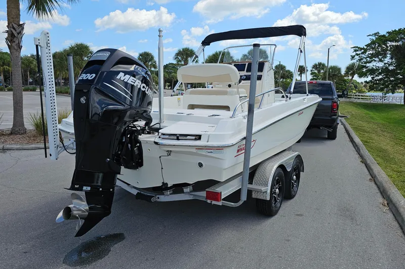 Slide: The Image of 2018 Boston Whaler 210 Dauntless boat on trailer with Mercury 200 engine. - 6