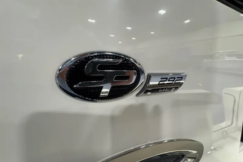 Slide: The Image of 2026 Sea Pro 292 DLX logo on a sleek white boat surface. - 101
