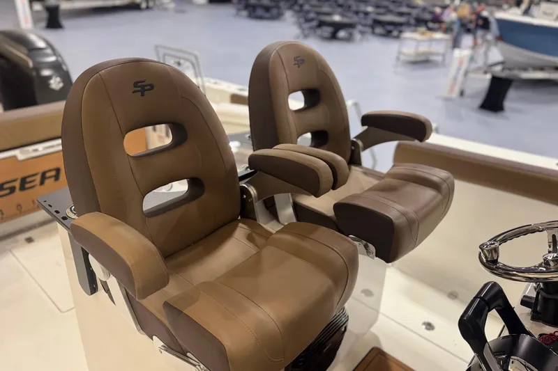 Slide: The Image of 2026 Sea Pro 292 DLX boat seats, brown leather, ergonomic design, luxury marine interior. - 105