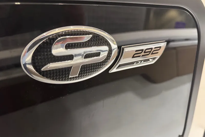 Slide: The Image of 2026 Sea Pro 292 DLX emblem on a sleek black surface. - 106