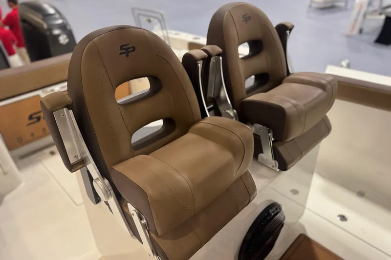 Slide: The Image of Brown leather seats on 2026 Sea Pro 292 DLX boat interior. - 110