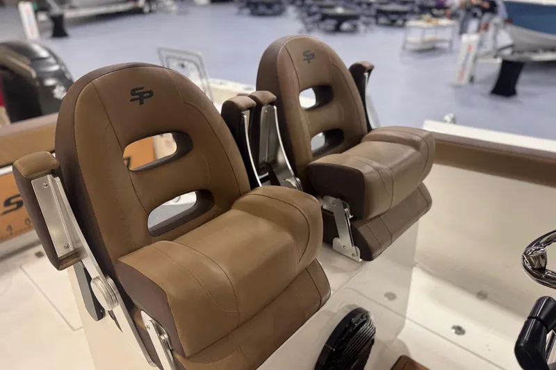 Slide: The Image of 2026 Sea Pro 292 DLX boat seats, brown leather, showroom display. - 112