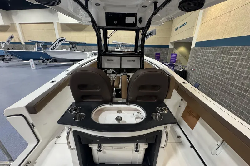 Slide: The Image of Interior view of 2026 Sea Pro 292 DLX boat with seating and control panel. - 114