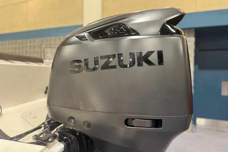 Slide: The Image of Suzuki outboard motor on 2026 Sea Pro 292 DLX boat, indoor display. - 120
