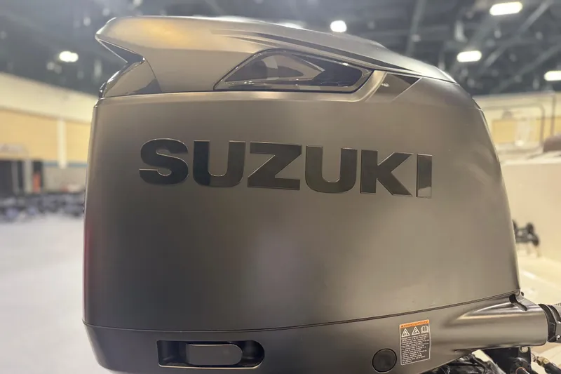 Slide: The Image of Suzuki outboard motor on 2026 Sea Pro 292 DLX boat, indoor display. - 122