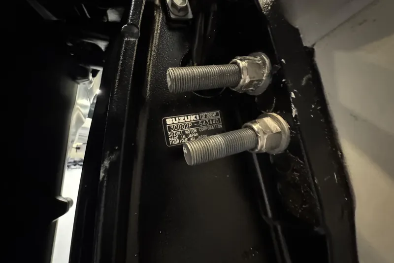 Slide: The Image of Close-up of Suzuki motor bolts on a 2026 Sea Pro 292 DLX boat. - 125