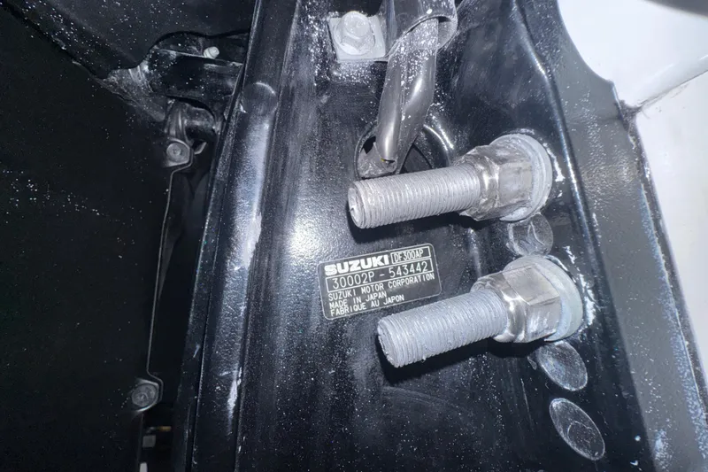 Slide: The Image of Close-up of Suzuki DF300AP engine bolts on 2026 Sea Pro 292 DLX boat. - 126