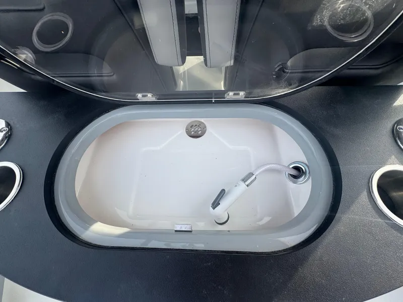 Slide: The Image of Livewell with hose in 2026 Sea Pro 292 DLX boat. - 18