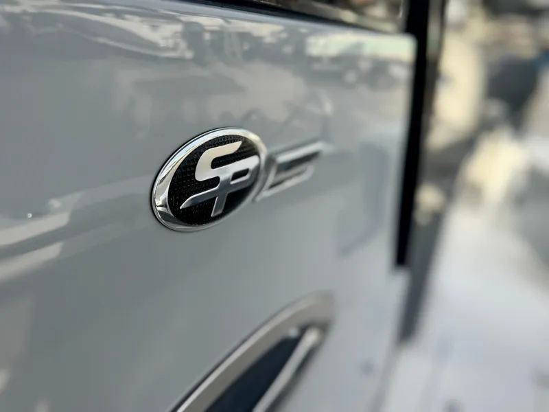 Slide: The Image of 2026 Sea Pro 292 DLX boat emblem on sleek exterior. - 26