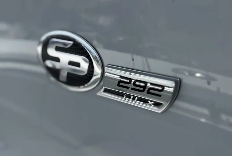 Slide: The Image of 2026 Sea Pro 292 DLX emblem on a sleek gray surface. - 3